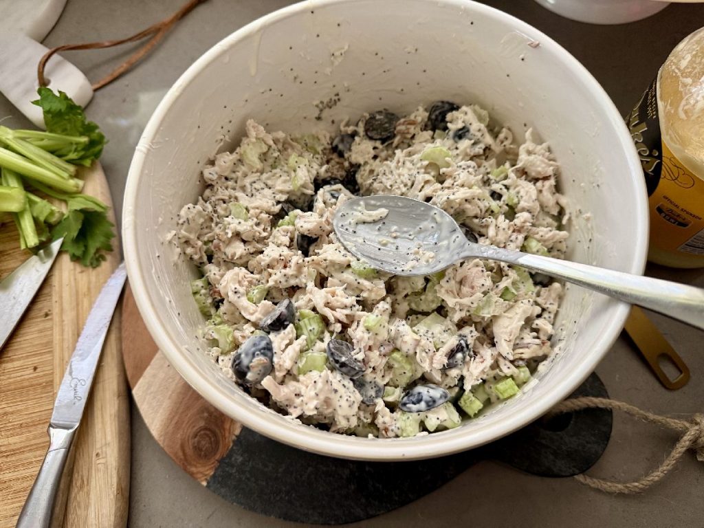 If you're looking for the best chicken salad recipe, look no further than my Aunt Tina's. It's a take on a Sonoma chicken salad, with a tangy & sweet dressing and lots of texture--absolutely perfect!  How to make Sonoma chicken salad, an easy chicken salad for barbecues, potlucks, and summer nights when it's too hot to cook. 