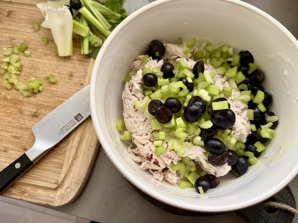 If you're looking for the best chicken salad recipe, look no further than my Aunt Tina's. It's a take on a Sonoma chicken salad, with a tangy & sweet dressing and lots of texture--absolutely perfect!  How to make Sonoma chicken salad, an easy chicken salad for barbecues, potlucks, and summer nights when it's too hot to cook. 