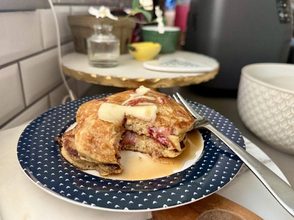 These strawberry cornmeal pancakes are the perfect summer brunch recipe...fresh summer strawberries in a golden crispy cornmeal pancake, drenched in maple syrup. 
