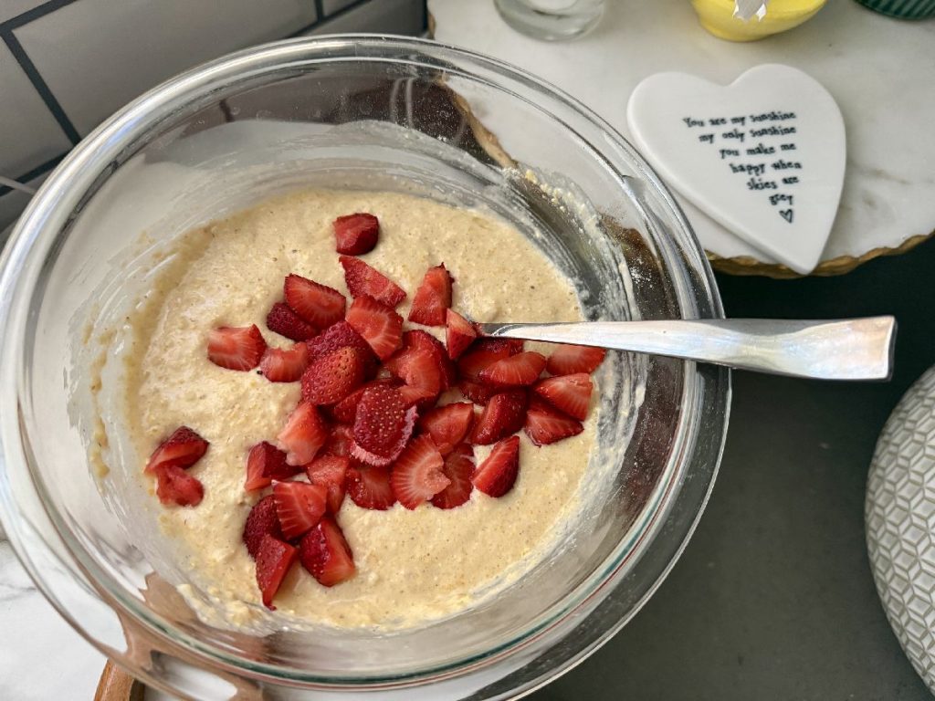 Strawberry Cornmeal Griddle Cakes | These strawberry cornmeal pancakes are the perfect summer brunch recipe...fresh summer strawberries in a golden crispy cornmeal pancake, drenched in maple syrup. Super easy and fancy-feeling breakfast, a great way to use fresh strawberries. 