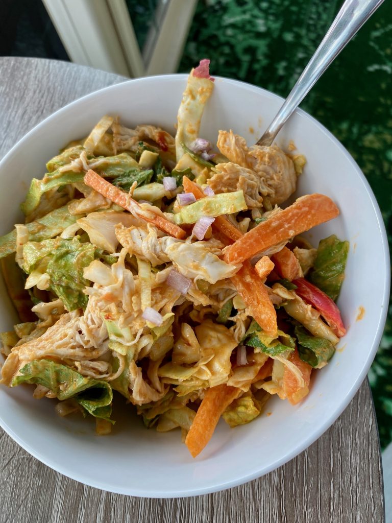 Easy & Healthy "Loaded" Thai Chicken Salad | This Thai cabbage salad is super easy to make, loaded with veggies & has a flavorful sweet-spicy-savory dressing that makes it a pleasure to eat! This healthy meal only takes 15 minutes to make & is a perfect easy weeknight meal. #chicken #healthydinner #healthyrecipe #cabbage 