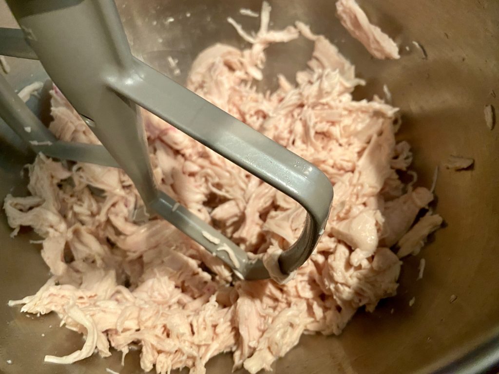 My super easy poached & shredded chicken adds protein to this Thai chicken salad