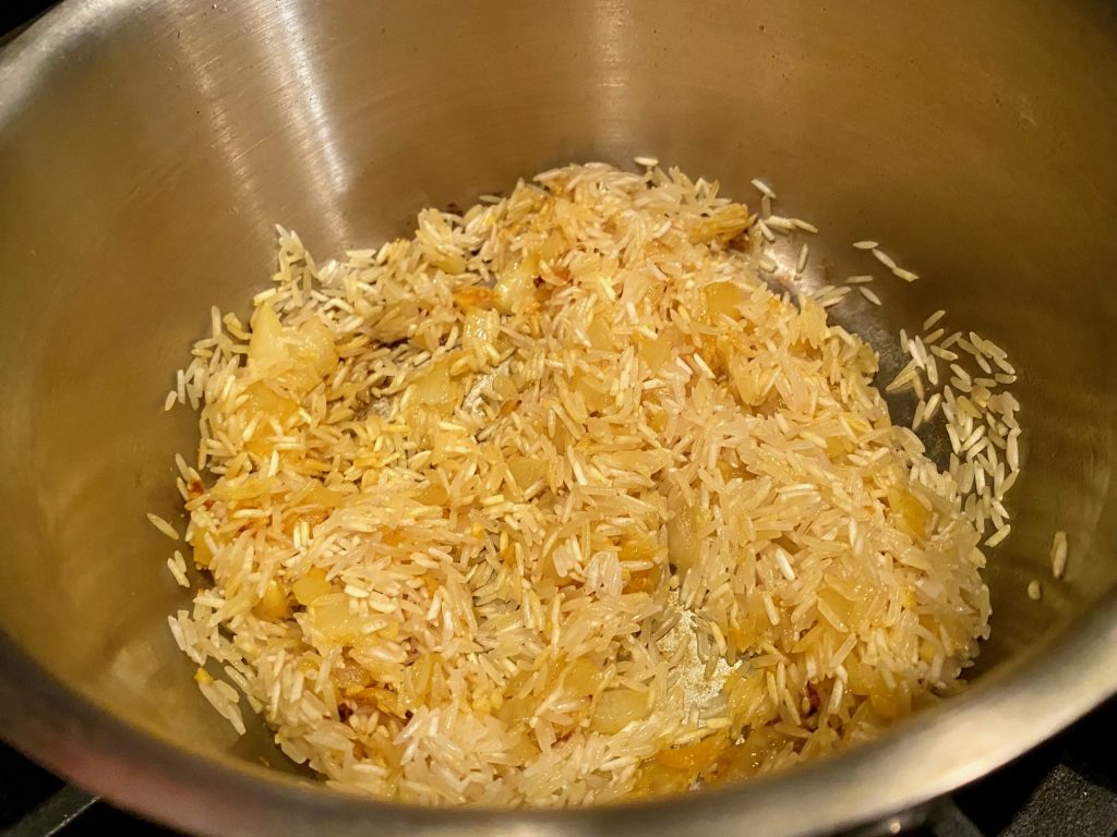 Sauteeing the rice to start the Mediterranean turmeric rice