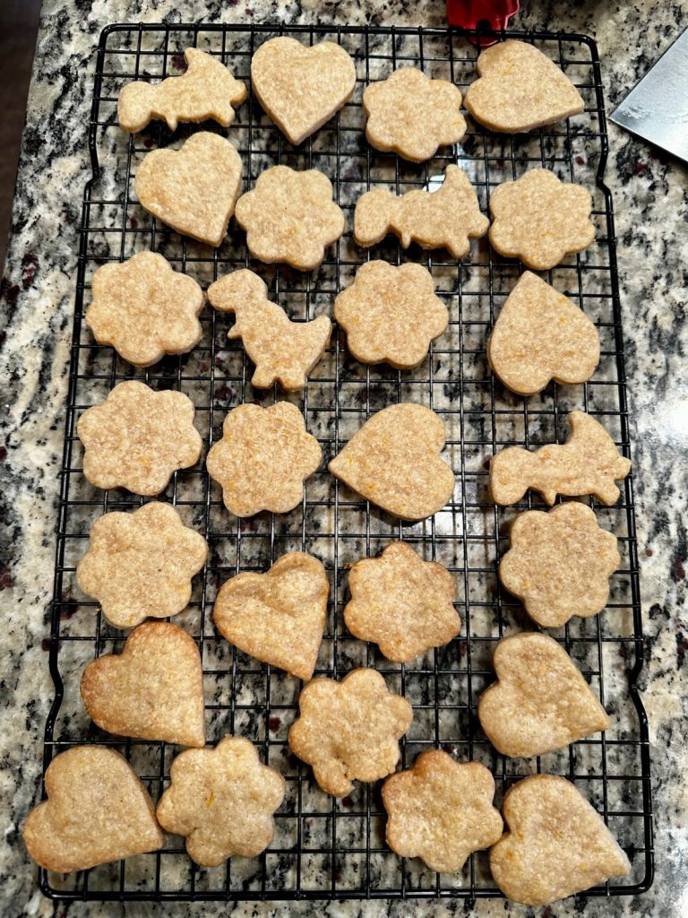 Easy Chai Spiced Shortbread Cookies | This delicious chai shortbread is melt-in-your-mouth perfection. These chai cookies are easy to make, packed with warm spices & a hint of orange, a lovely treat! Easy cookie recipes, chai desserts, chai spices, afternoon tea recipes. #cookierecipes #cookies #chaispice #shortbread This delicious chai shortbread is melt-in-your-mouth perfection - cookies cooling on a rack