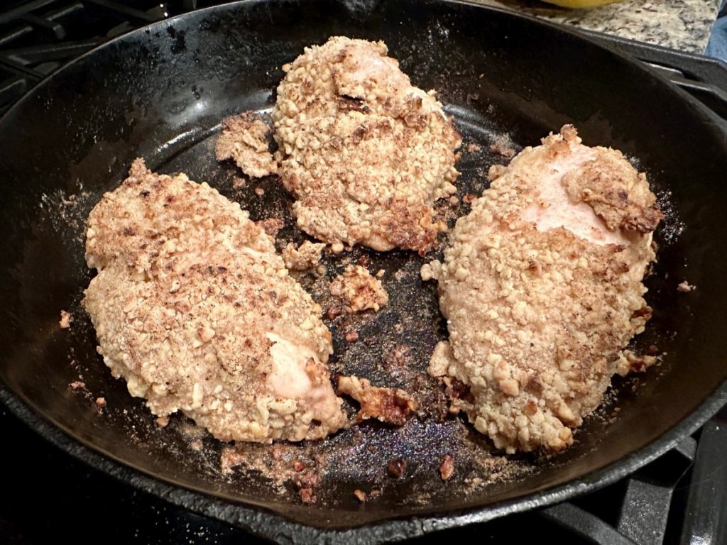 keeping the coating on these walnut-coated chicken breasts is tough, but they're delicious