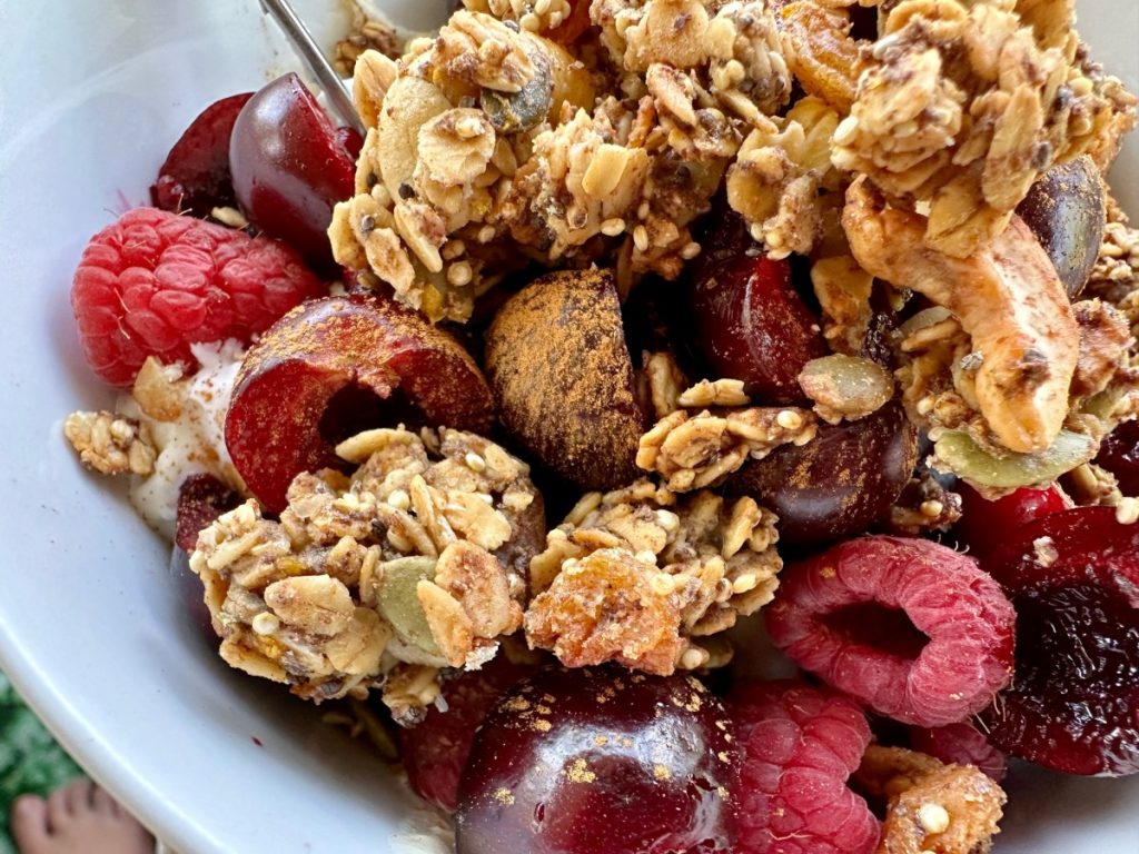 This delicious spiced orange honey granola is practically a superfood! It's high in protein & fiber, packed with nutrients, low in sugar, & SO easy to make.