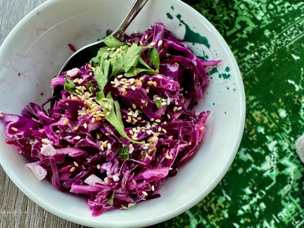 This unique red cabbage, feta, & date salad is vibrant and delicious, an easy, healthy side dish that's perfect for any occasion