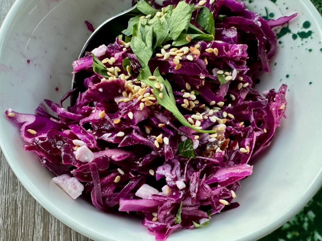 This unique red cabbage, feta, & date salad is vibrant and delicious, an easy, healthy side dish that's perfect for any occasion
