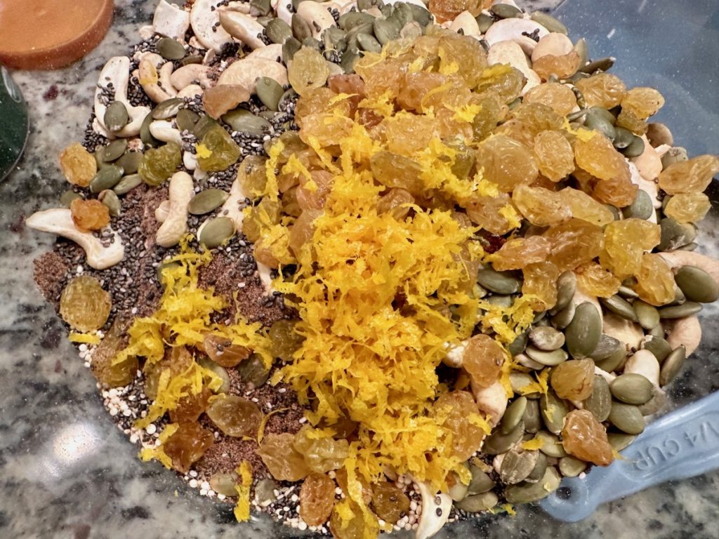 This delicious spiced orange honey granola is practically a superfood! It's high in protein & fiber, packed with nutrients, low in sugar, & SO easy to make.