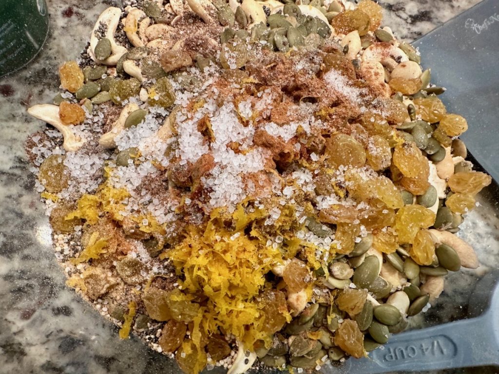 This delicious spiced orange honey granola is practically a superfood! It's high in protein & fiber, packed with nutrients, low in sugar, & SO easy to make.