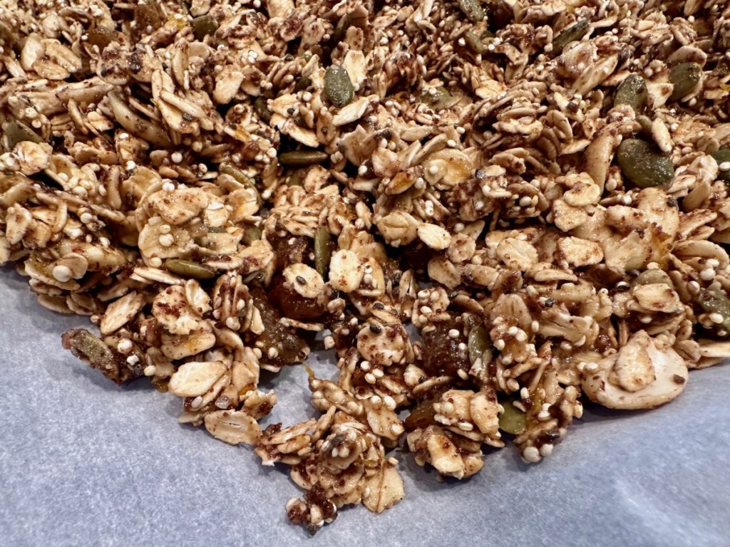 This delicious spiced orange honey granola is practically a superfood! It's high in protein & fiber, packed with nutrients, low in sugar, & SO easy to make.