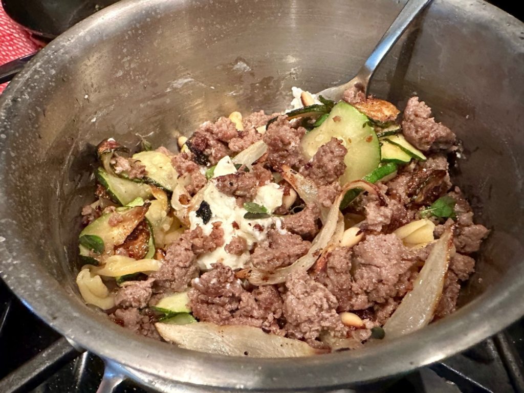 toss together the zucchini, beef in white wine, roasted onions, pine nuts, fresh oregano, & creamy goat cheese for this amazing pasta