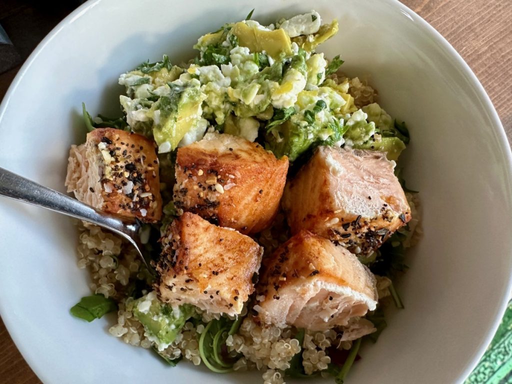 This delicious salmon power bowl with quinoa and a punchy salty-citrus avocado salsa is an amazing, easy, healthy meal that's perfect for busy weeknights. 