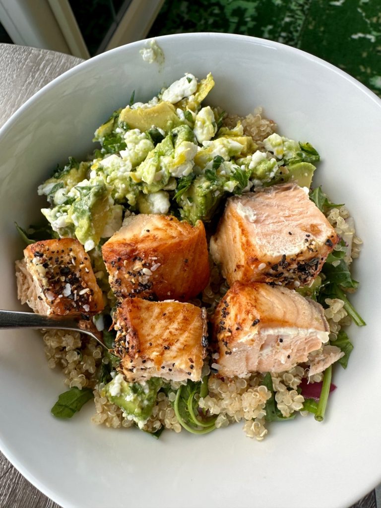 This delicious salmon power bowl with a punchy salty-citrus avocado salsa is an amazing, easy, healthy meal that's perfect for busy weeknights & can be meal prepped