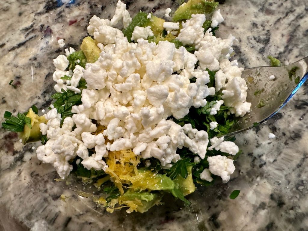 making a fast & delicious lemon feta avocado salsa to go with our salmon & quinoa power bowls