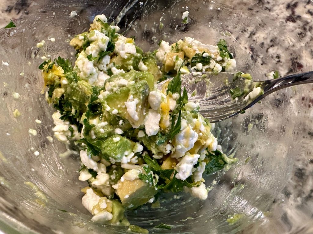 making a fast & delicious lemon feta avocado salsa to go with our salmon & quinoa power bowls
