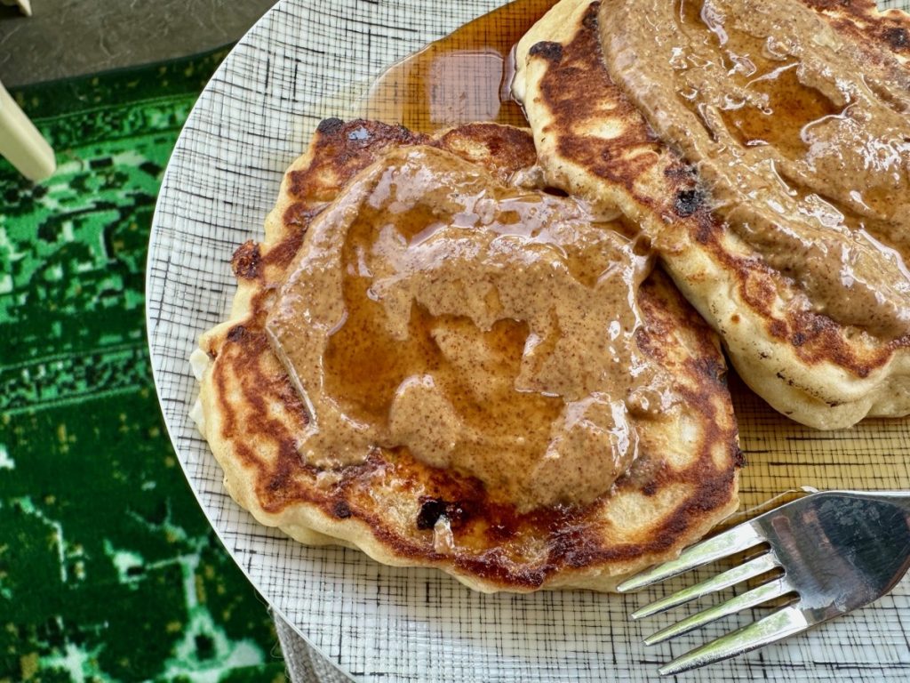 Delicious & easy high-protein cottage cheese pancakes with almond butter & syrup