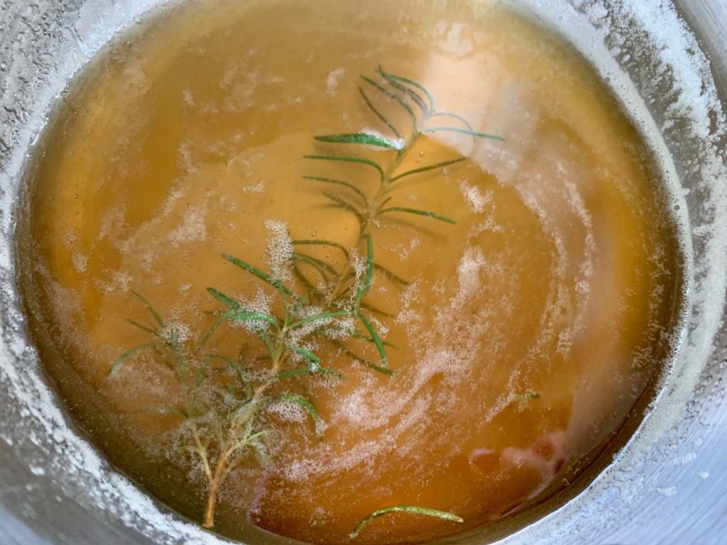 How to Make Demerara Simple Syrup in 2 Minutes | If you're looking for the best simple syrup for old fashioned cocktails, bourbon drinks, & coffee, this easy demerara (raw sugar) simple syrup is the way to go! It's so much better than simple syrup made with regular granulated sugar. You only need raw sugar and water, and you can add some herbs or spices at the end if you desire. 