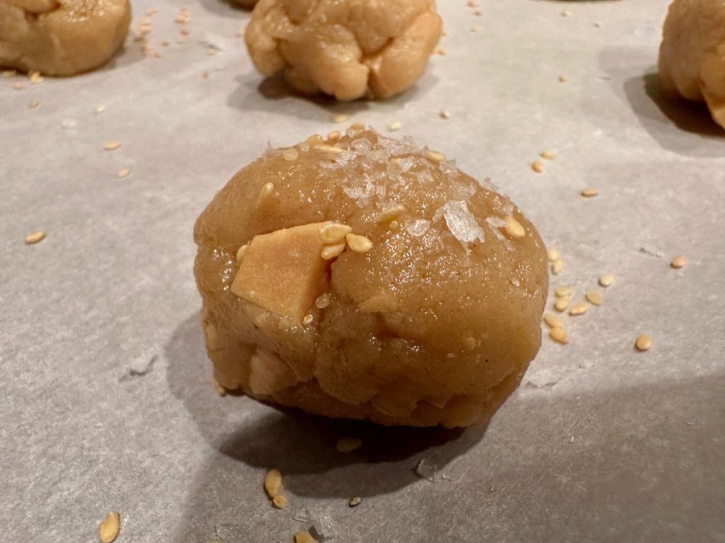 These sesame, tahini, and caramelized white chocolate cookies have a subtle and intriguing flavor, ready to bake