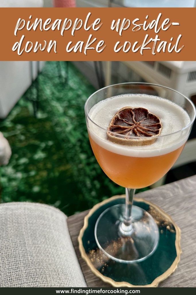 Pineapple Upside-Down Cake Cocktail | You didn't know you needed a pineapple upside-down cocktail in your life, but you do! This easy & delicious drink uses a good dark rum, pineapple juice, and cinnamon syrup with a hit of tart lime that brings a tropical vibe in even the coldest weather! Spiced pineapple cocktail, what to make with pineapple juice.