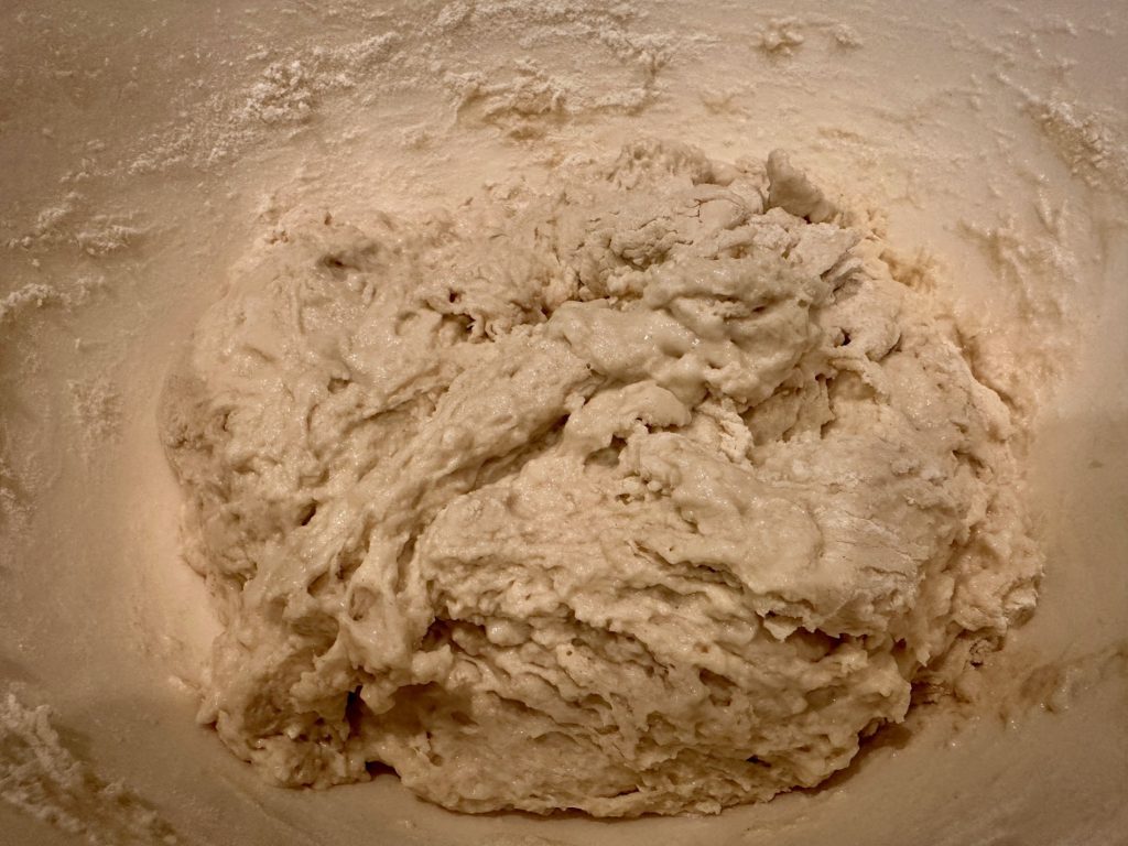 You want a nice sticky, shaggy dough for bread in the air fryer