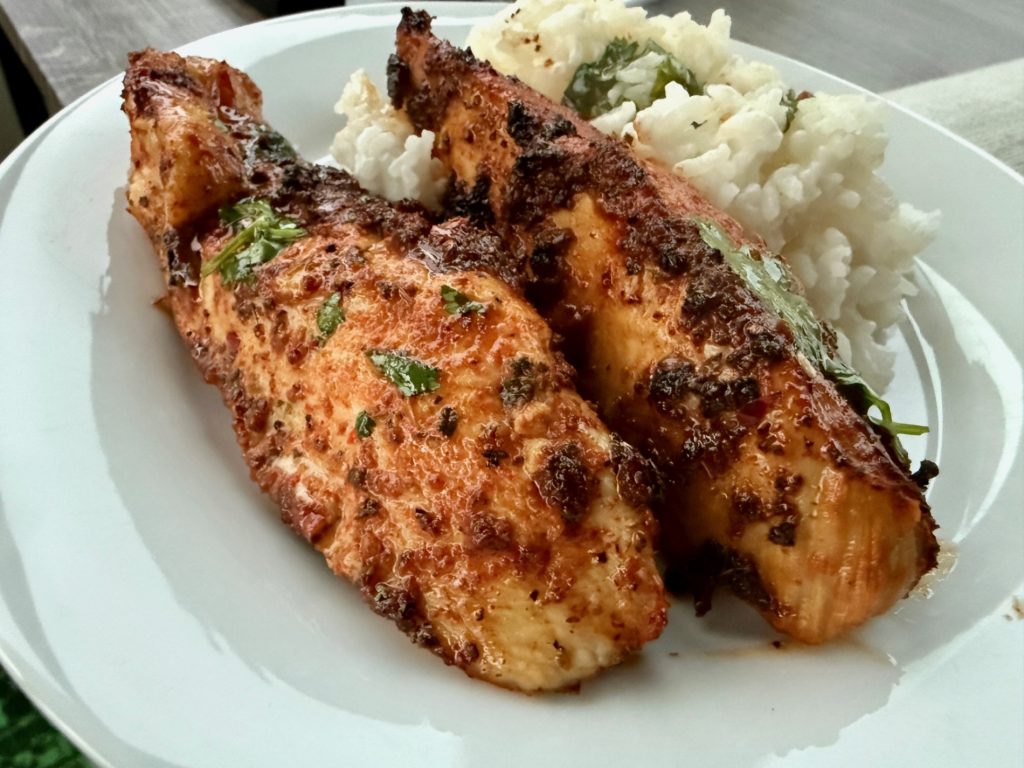 Hot Honey Lime Chicken with Coconut Rice | This honey lime cilantro chicken is super easy and SO delicious, a perfect 30-minute meal.  The chicken and sauce are packed with flavor, and it pairs perfectly with an easy coconut rice.  It makes great leftovers as well!  