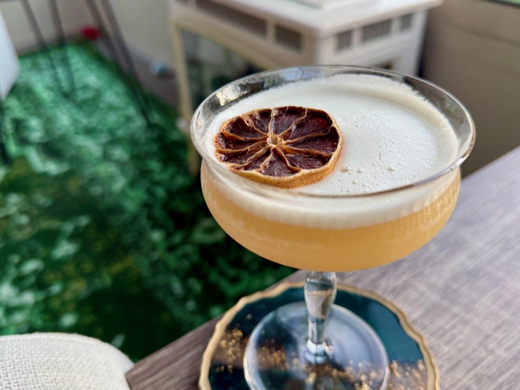 This subtle, refreshing spiced banana whiskey sour cocktail is absolutely delicious! It relies on banana-infused bourbon, which is super easy to make and really elevates the flavors in this cocktail.