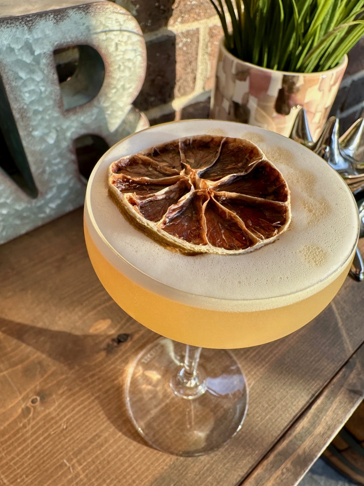 This subtle, refreshing spiced banana whiskey sour cocktail is absolutely delicious! It relies on banana-infused bourbon, which is super easy to make and really elevates the flavors in this cocktail.