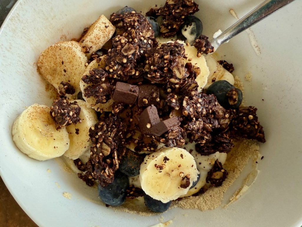 This dark chocolate granola is healthy and SO delicious. Packed with cocoa flavor but made with only a little maple syrup and tons of healthy ingredients (quinoa, oats, seeds, nuts), it's a perfect treat for topping granola or snacking on.