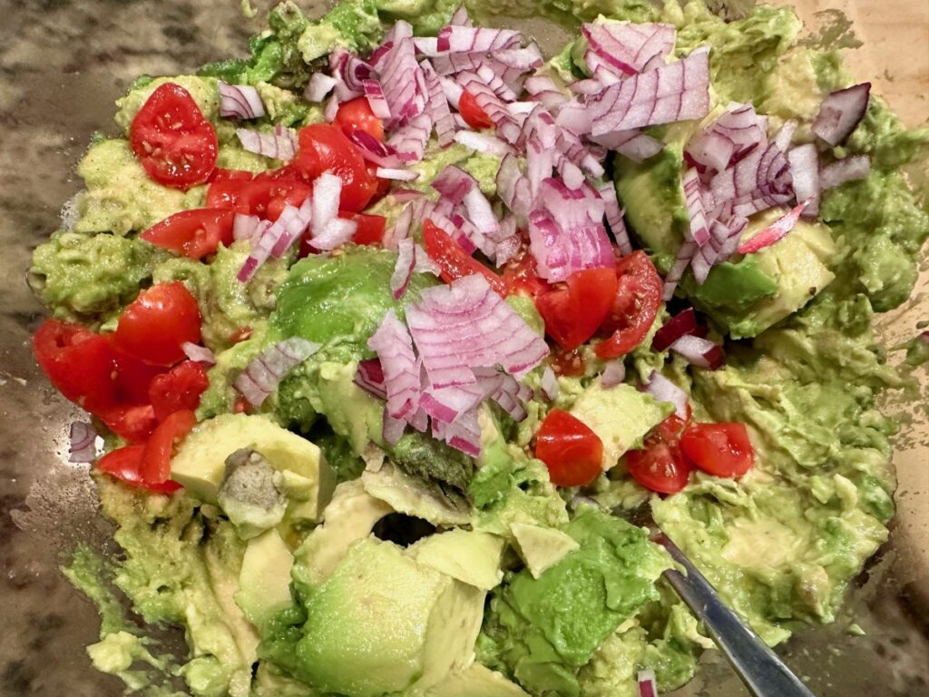 My best guacamole recipe includes a bit of red onion and tomato