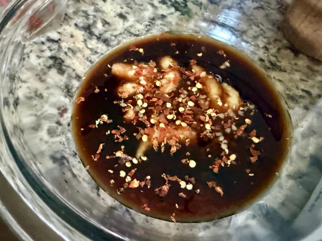 whipping up this miso ginger sauce that the roast cooks in