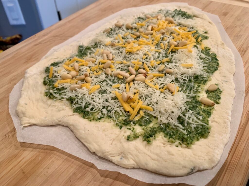 How to Make Grilled Pesto Pizza | Grilled pizza is one of the easiest & most delicious weeknight meals, and pesto pizza is one of my most popular pizza flavor combos.  I strongly believe in using fresh homemade pesto makes this taste so much better!  