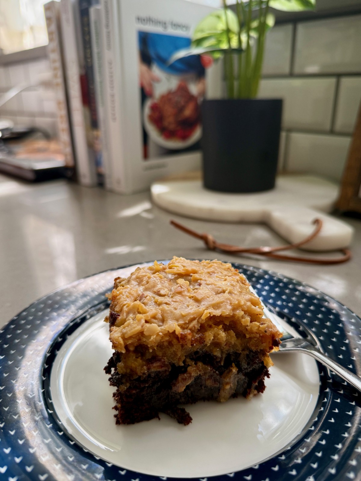 How to Make German Chocolate Cake | You'll never go store-bought again!  This homemade German chocolate cake is insanely delicious and super easy to make.  Pair a rich, fudgy chocolate cake with the famous caramel pecan coconut frosting for a special treat that's perfect for any occasion.  This is the best German chocolate cake recipe, an iconic American dessert. 