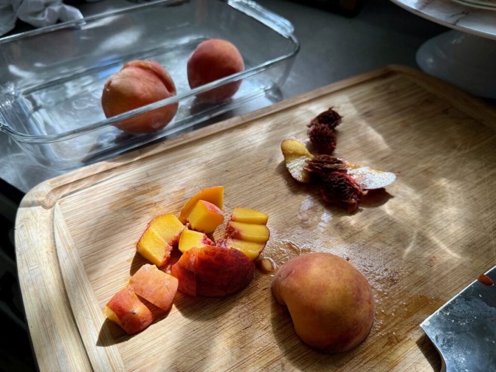 cutting up peaches in summer with beautiful sunlight