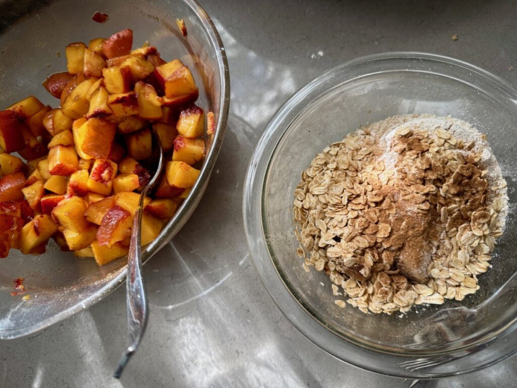The Perfect Peach Crisp | This brown butter bourbon peach crisp is the ultimate version of this American classic, and a pure summer treat! All you need are delicious ripe peaches and only a few minutes of hands-on time. The is the best peach crisp out there.