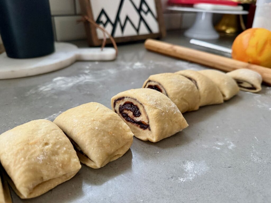 These delicious 1-hour (ish) chocolate cinnamon rolls with orange glaze are super fast to make, a perfect option when you need to pull together brunch or a baked good gift quickly.
