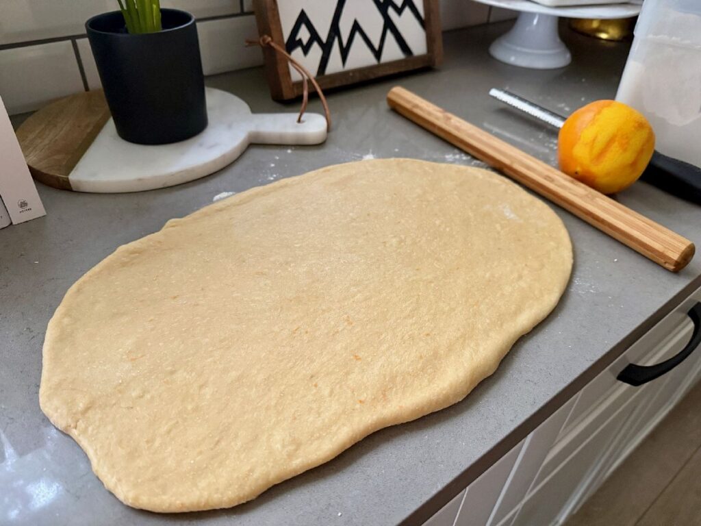 rolling out the dough for these delicious 1-hour (ish) chocolate cinnamon rolls