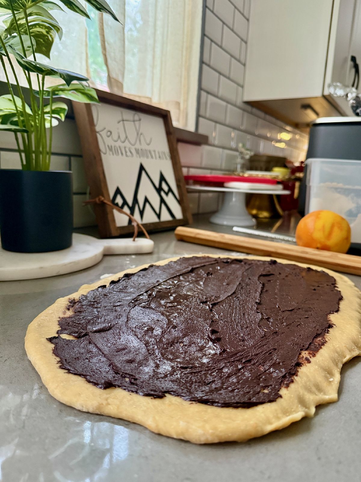 1-Hour(ish) Chocolate Cinnamon Rolls with Orange Glaze | These delicious chocolate rolls only take a bit over an hour to make, a perfect option when you need to pull together brunch or a baked good gift quickly. Rather than spending 4+ hours rising, rolling, and baking, these can be ready in just over an hour when you're pressed for time, and they're absolutely delicious! Drizzle with an easy fresh orange flavored glaze, and you've got a winner.