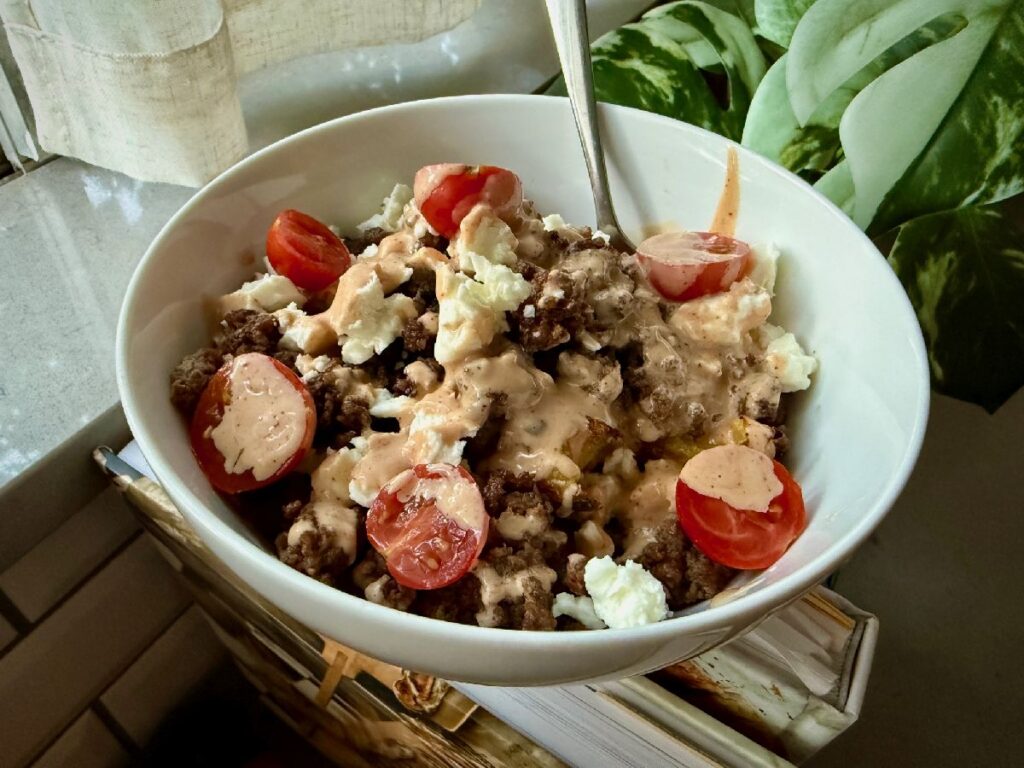 Healthy Loaded Cheeseburger Bowls with Smashed Potatoes | These healthy cheeseburger bowls are a super easy weeknight meal that's flexible for all types of tastes and dietary restrictions.  You can whip it up in a very short time (especially if you boil the potatoes ahead and keep them in the fridge), and it feels indulgent while being packed with nutrients.  A winner weeknight meal, 30 minute meal, one bowl meals, meal prep ideas. 