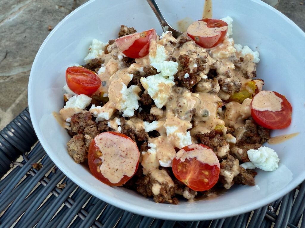 Healthy Loaded Cheeseburger Bowls with Smashed Potatoes | These healthy cheeseburger bowls are a super easy weeknight meal that's flexible for all types of tastes and dietary restrictions.  You can whip it up in a very short time (especially if you boil the potatoes ahead and keep them in the fridge), and it feels indulgent while being packed with nutrients.  A winner weeknight meal, 30 minute meal, one bowl meals, meal prep ideas. 