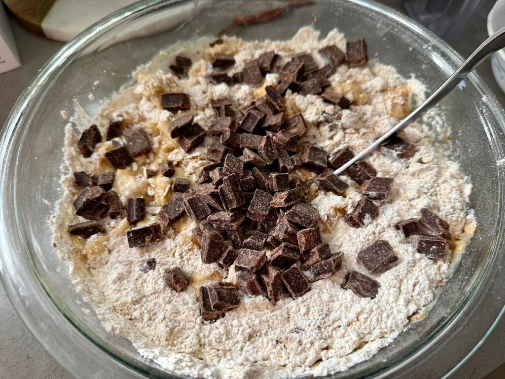 These spiced pear, hazelnut, and dark chocolate muffins are packed with warm spices and fun textures...a cozy hug whether it's a breakfast treat or an afternoon snack!  One of the best muffin recipes for fall and winter.