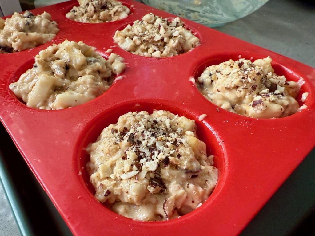 These spiced pear, hazelnut, and dark chocolate muffins are packed with warm spices and fun textures...a cozy hug whether it's a breakfast treat or an afternoon snack!  One of the best muffin recipes for fall and winter.