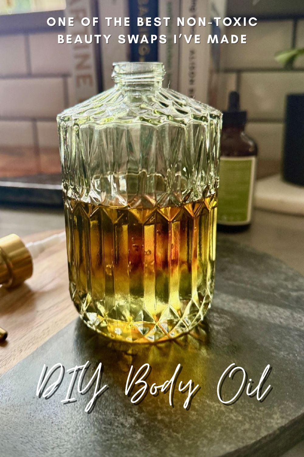 How to Make Clean, Moisturizing Body Oil | If you've been making healthy non-toxic beauty product swaps, this DIY homemade body oil recipe is super healthy, makes your skin feel amazing, & will save you money!  It's super easy to make, and much more cost-effective than buying it.  I've realized that body oil (on damp skin) is so much more moisturizing than lotion or body butter, especially for my 40+ year old skin! #cleanbeauty #nontoxliving #nontoxic #beautyproducts