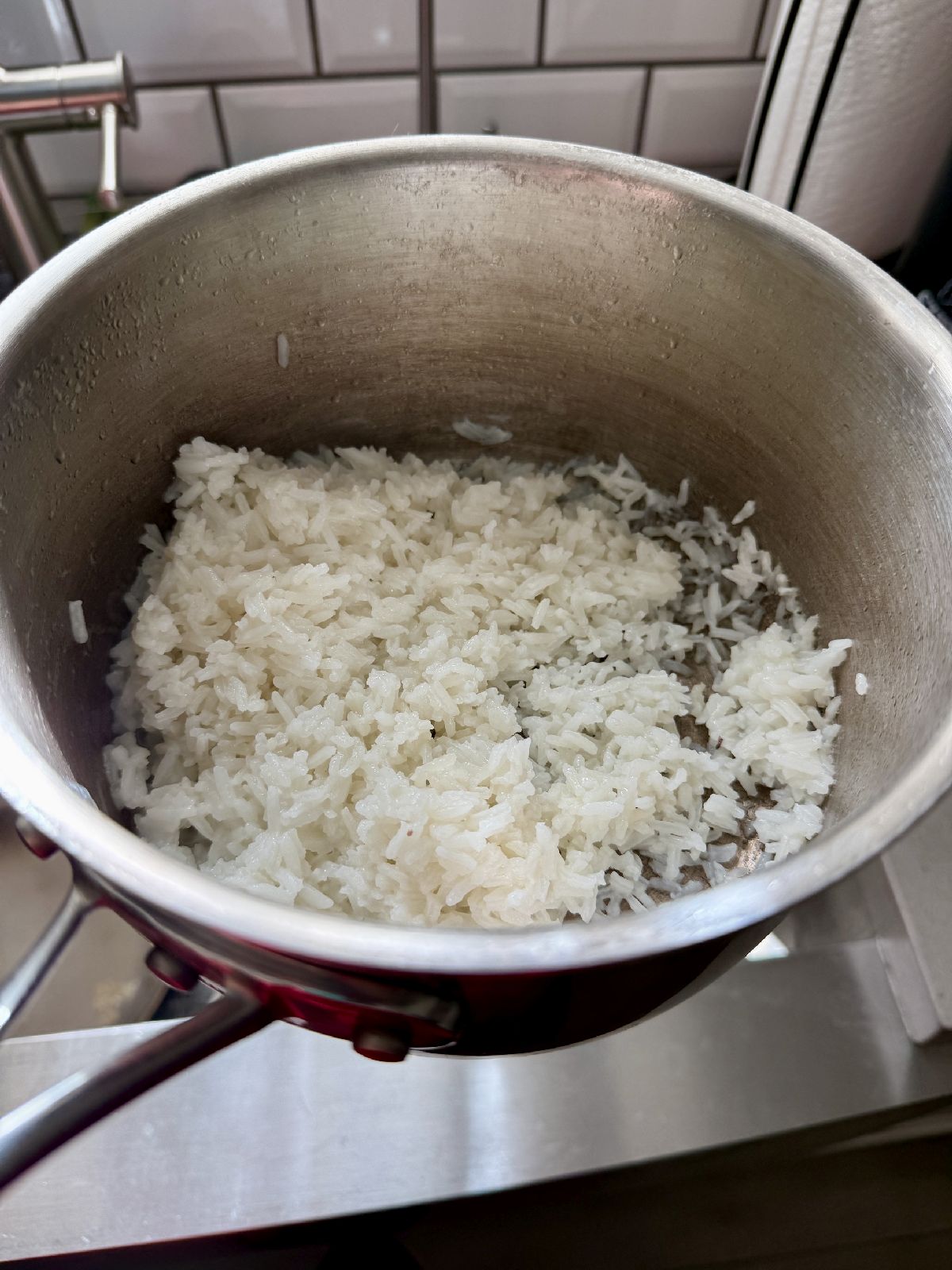 How to make easy coconut rice...this coconut jasmine rice has become a staple in my house, something I make probably once a week!  It's super easy and fast, goes with almost everything, and makes for awesome leftovers as well. 
