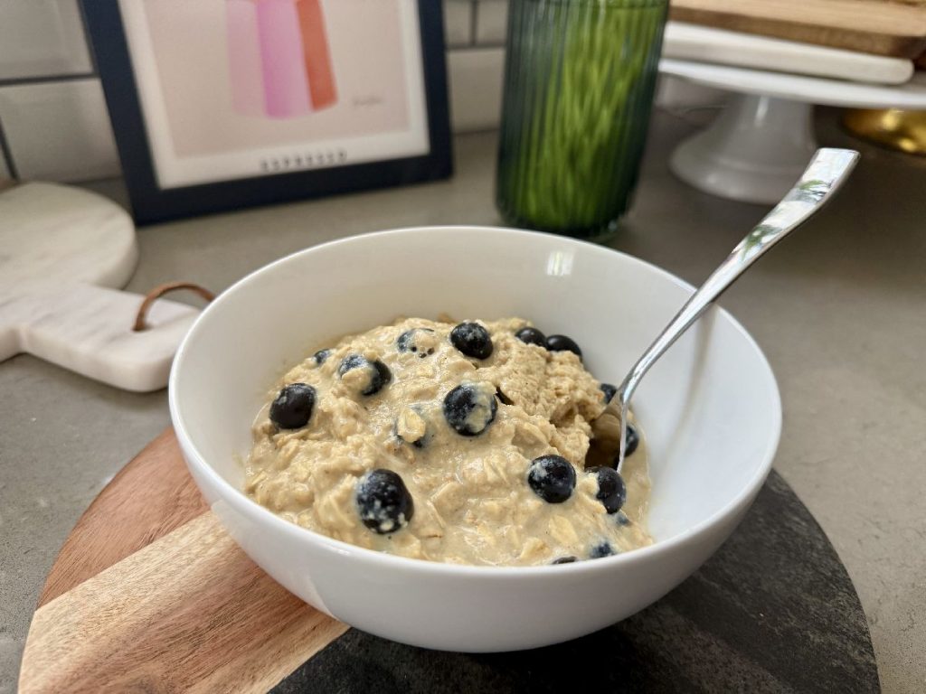 This custardy vanilla blueberry oatmeal has a secret ingredient--an egg added for texture and a bit of protein.  It's a creamy comfort food breakfast that packs a pretty decent nutritional profile--great fiber, nutrients, & a bit of protein and healthy fat.  It also takes less than 5 minutes to whip up, which makes it a winner most mornings for me!  A fast healthy breakfast everyone will love. 