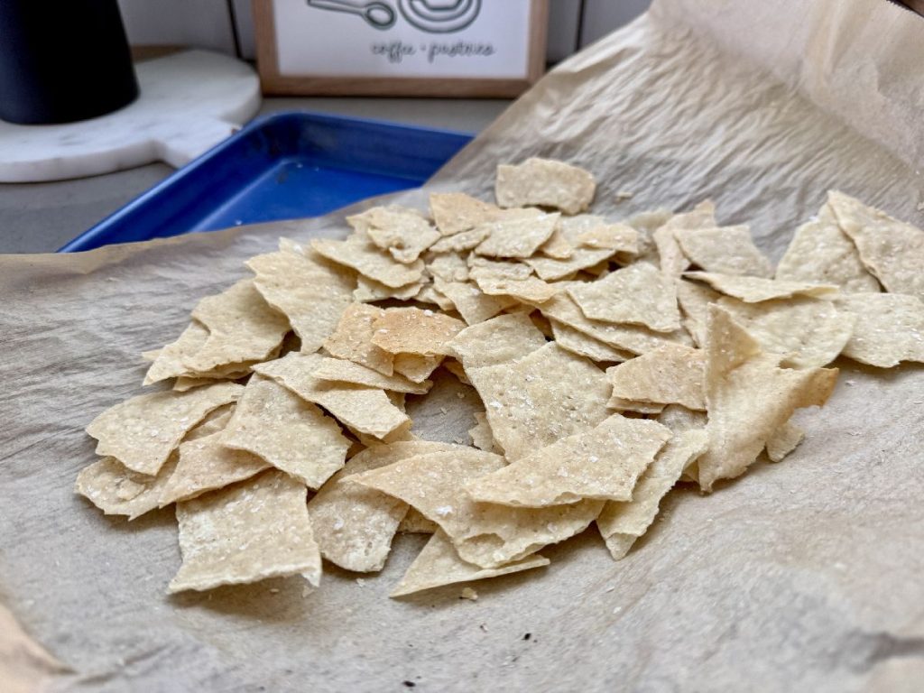 breaking up thin crispy crackers into bite-size pieces