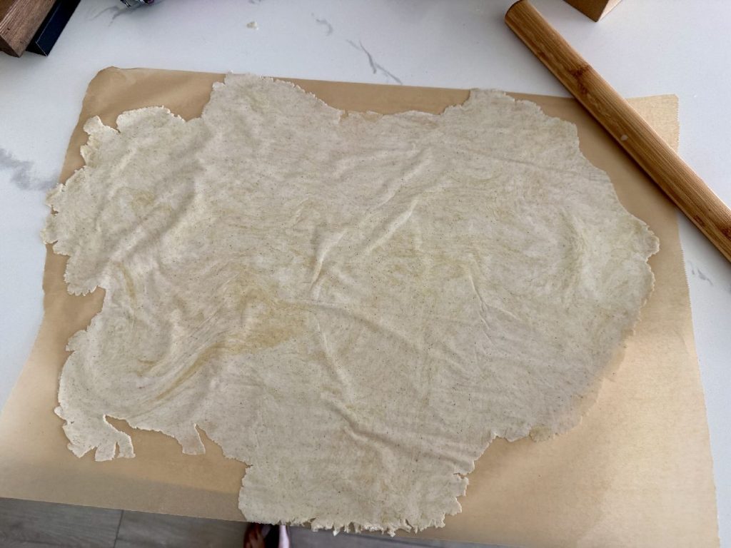 one of the keys to these thin crispy crackers is to roll the dough paper thin