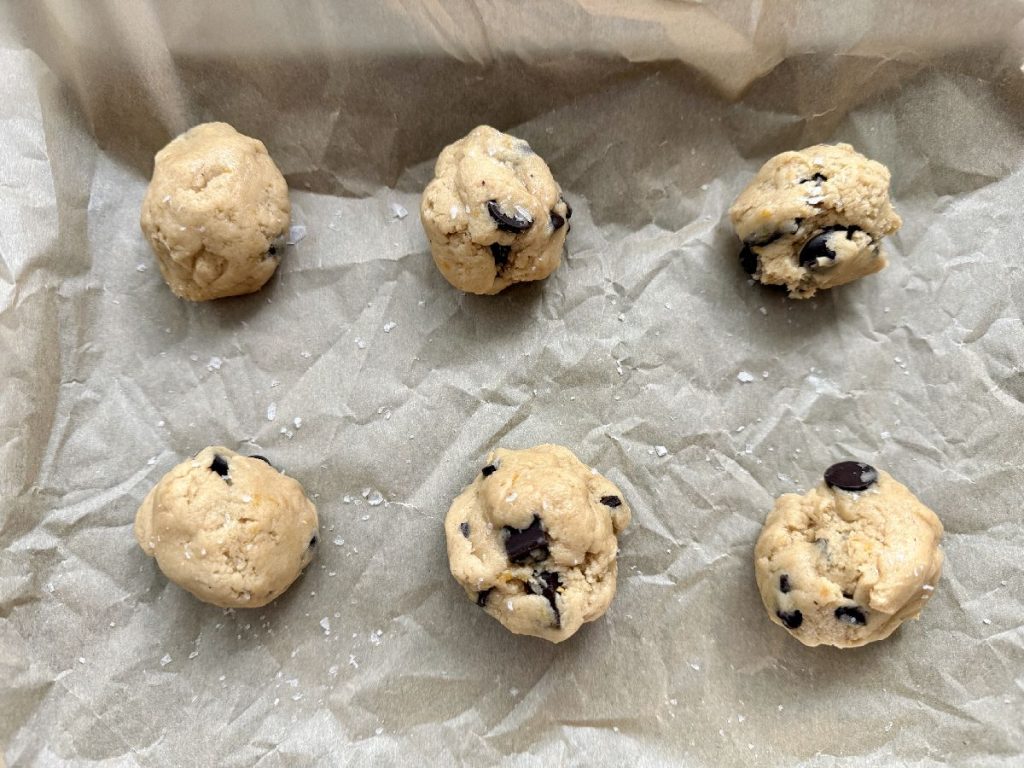 balls of orange tahini chocolate chip cookie dough